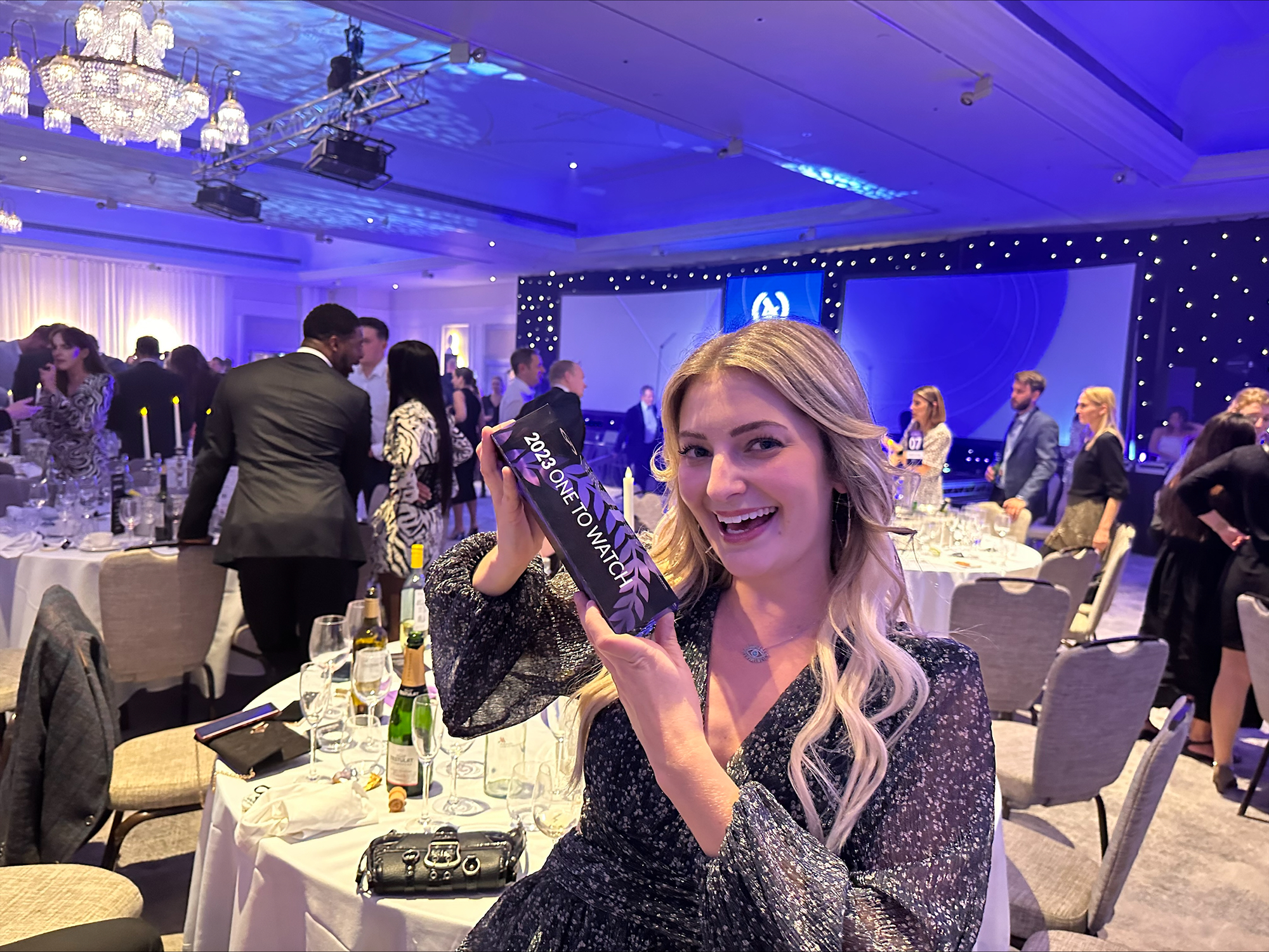 Liz Hoover holding the One to Watch award