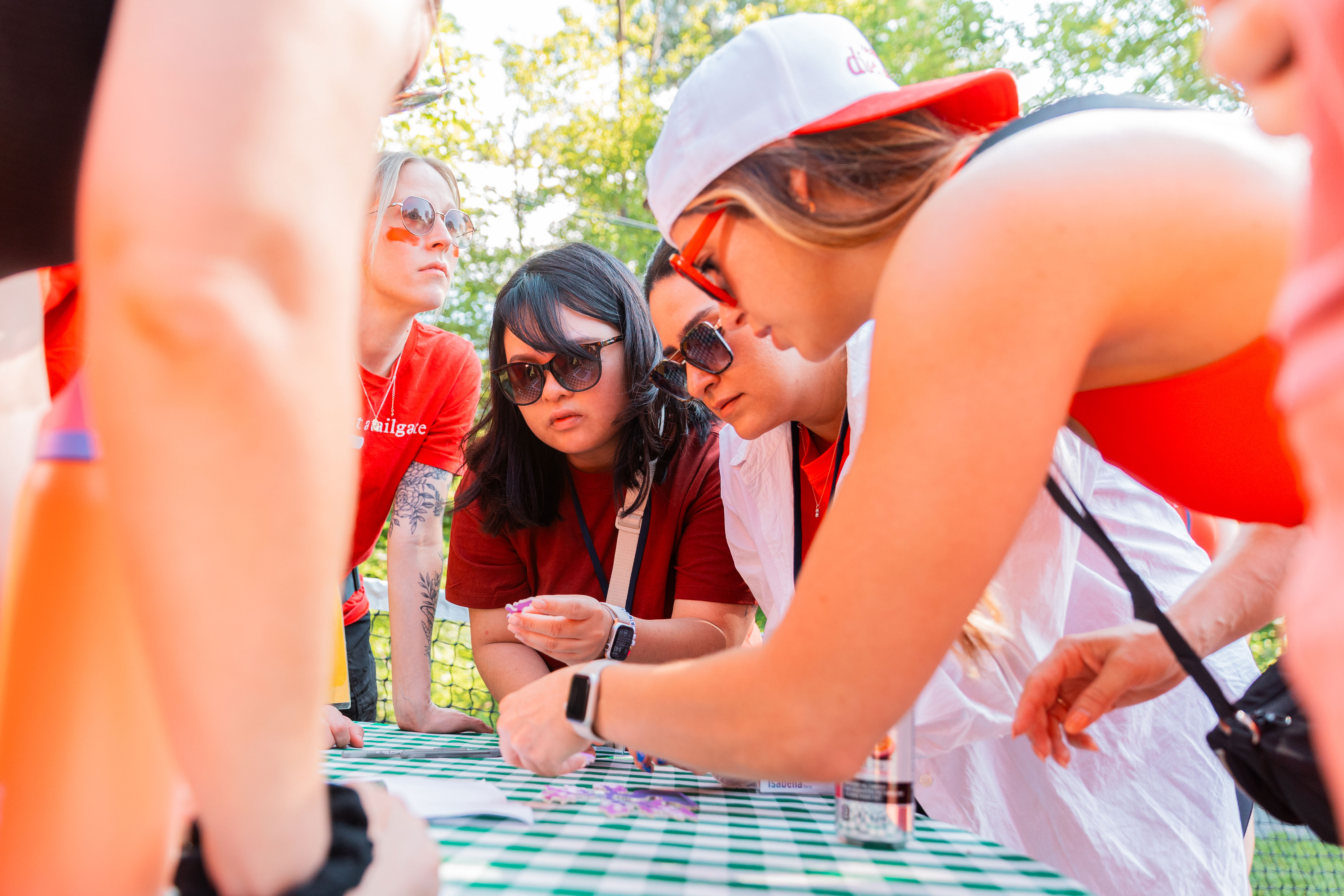 DMi Partners employees collaborating on a hands-on team activity outdoors